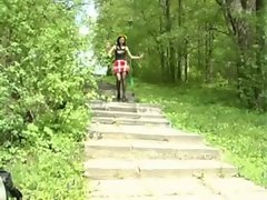 Alluring young woman pissing in the forest