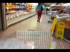 Sensual butt in red transparent leggins (without underwear) in supermarket