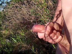 Wanking and cumming near the beach