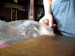 Jerking off into a plastic bag