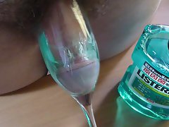 Phallus dipped in Listerine Fresh Mint mouthwash with cumshot