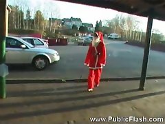 Santa young woman doing a striptease on camera