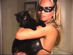 Light-haired as Catwoman in skintight ebony leather