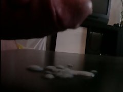 White cumshot on ebony table