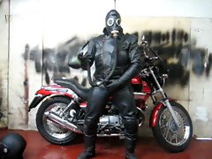 leather and rubber masked motorcycle wank