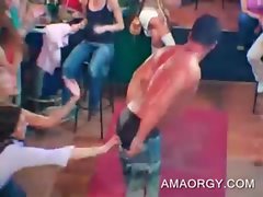 Sensual muscled stripper dancing at a CFNM sex party