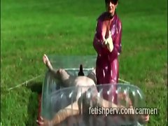 Euro dominatrix wraps masohist perv in plastic outdoors