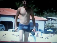 lewd chap walking on beach rubbing his bulge