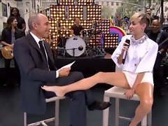 miley cyrus plays footsie