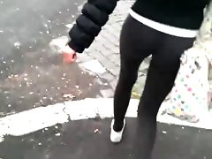 slim raunchy teen in leggings with a gorgeous bum walking fast