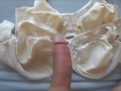 Big cumshot in two white bras .