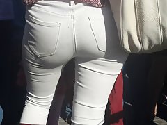 Butt in white jeans .