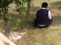 Public wanking behind a man in a park