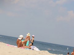 Sunny day on public naked beach
