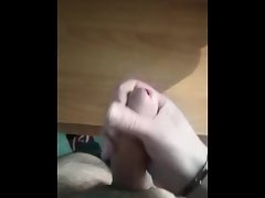 Guy jerking off a huge dick and pouring himself with sperm