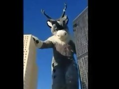 Giant caribou stomping throw a city