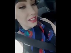 Sexy girl in car fingering herself
