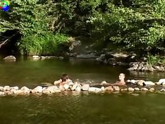 Naturist studs walk thru the stream and then talk