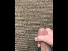 Jerking off in an empty office with spunk shot