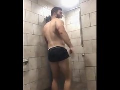 attractive man strips and showers