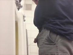 Spy two heterosexual fellows pissing at the urinals